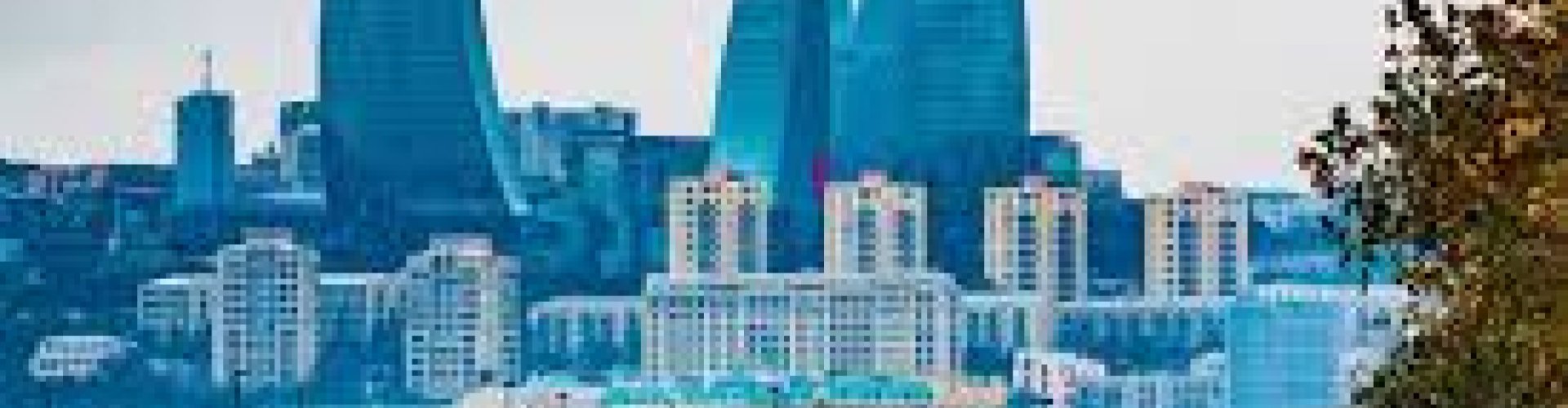 Night tram gliding on cobblestones in Baku