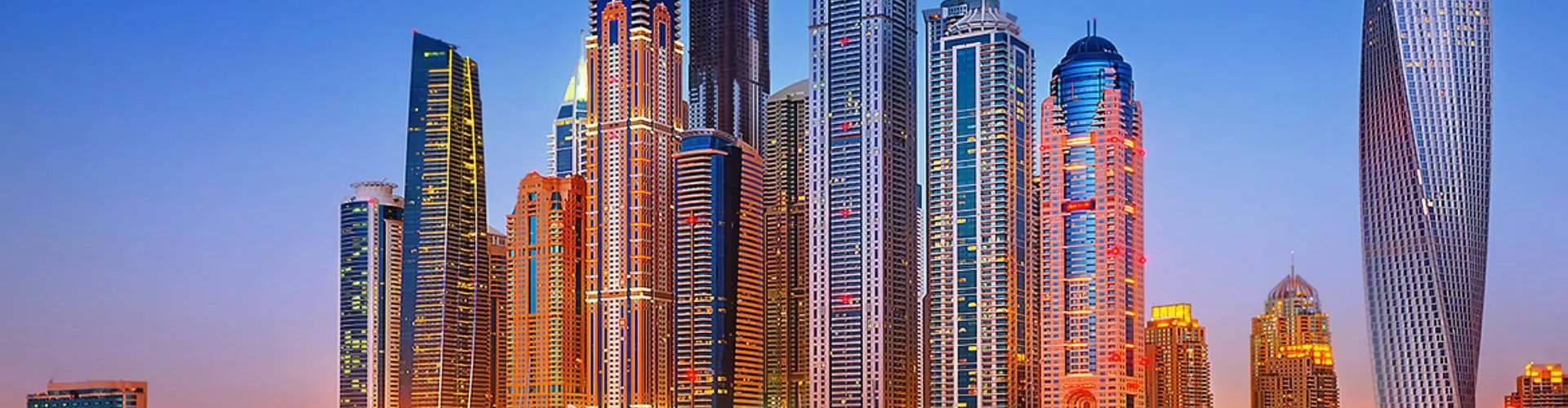 Night tram gliding on cobbled street in Dubai