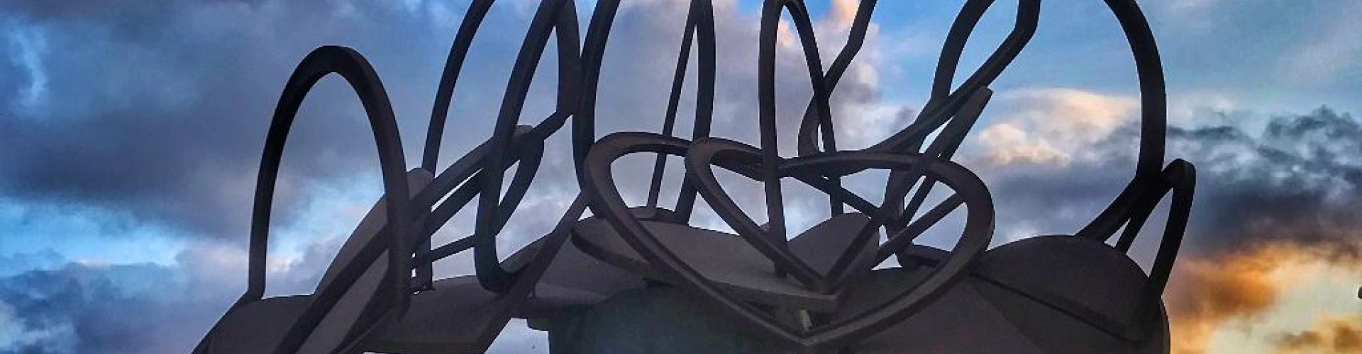 Night tram gliding on cobblestone street in Molina de Segura
