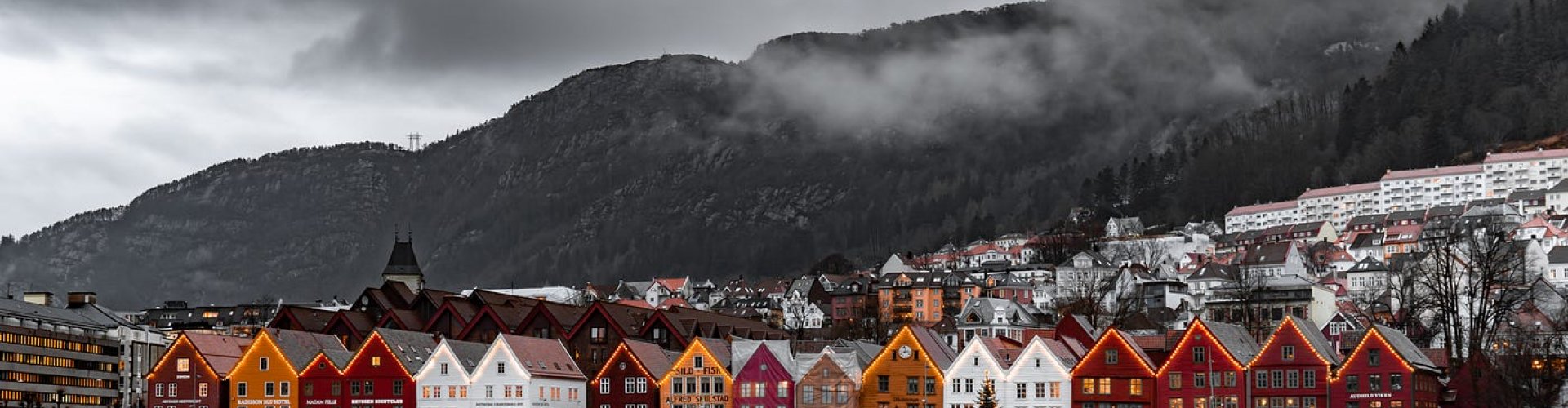 Night tram gliding on cobblestones in Oslo