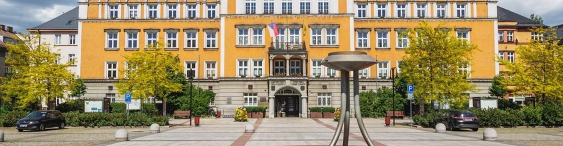 Night tram gliding across cobblestone street in Český Těšín