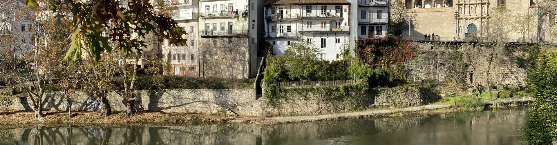 Night tram gliding on cobblestones in Amarante
