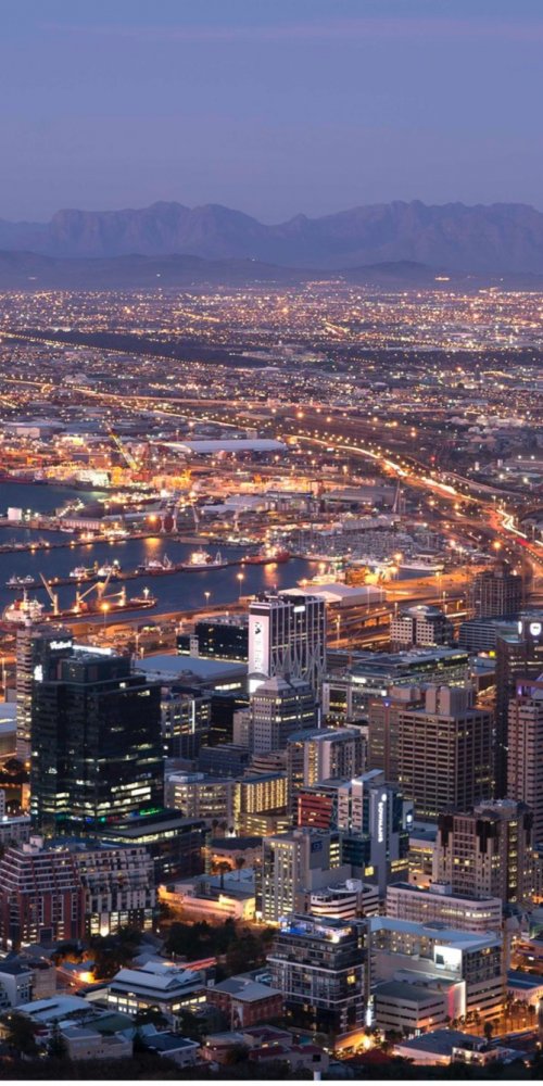 Passenger with bike-share and evening metro Cape Town