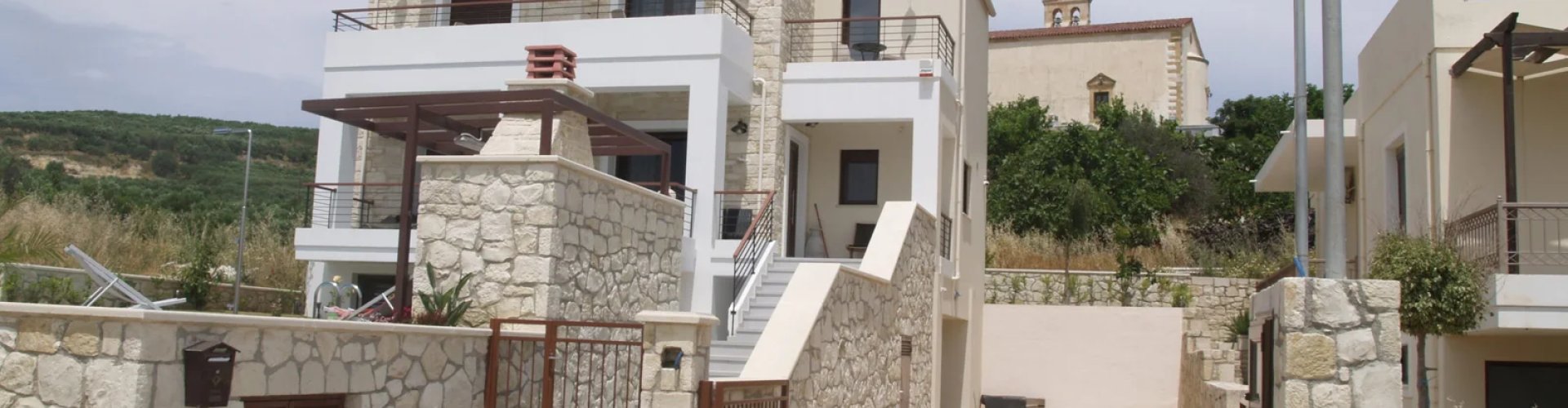 Night tram on cobblestone street in Kolimvari