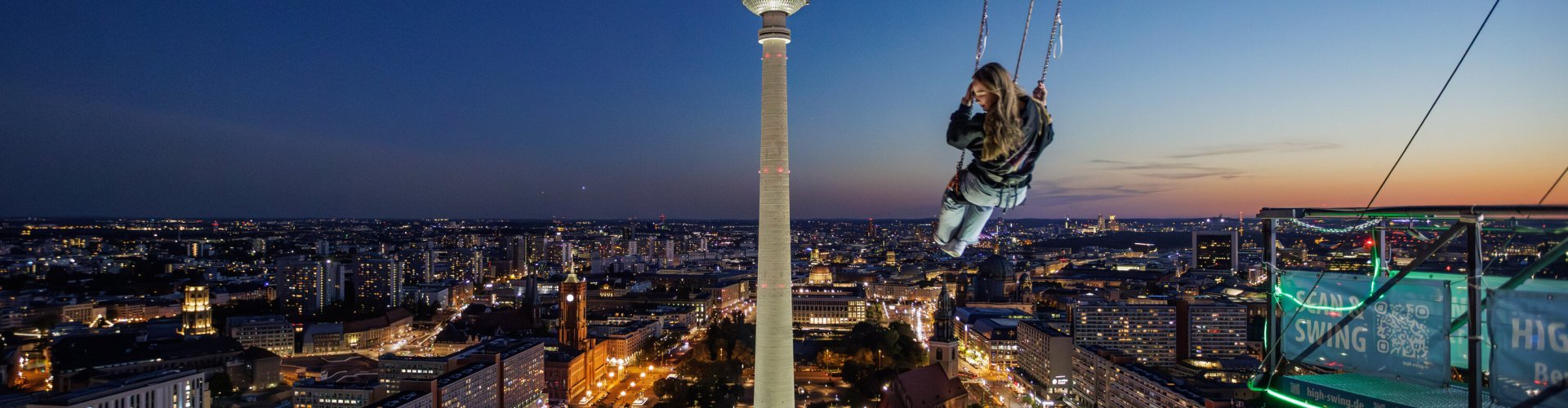 Night tram passing cobblestone street Berlin