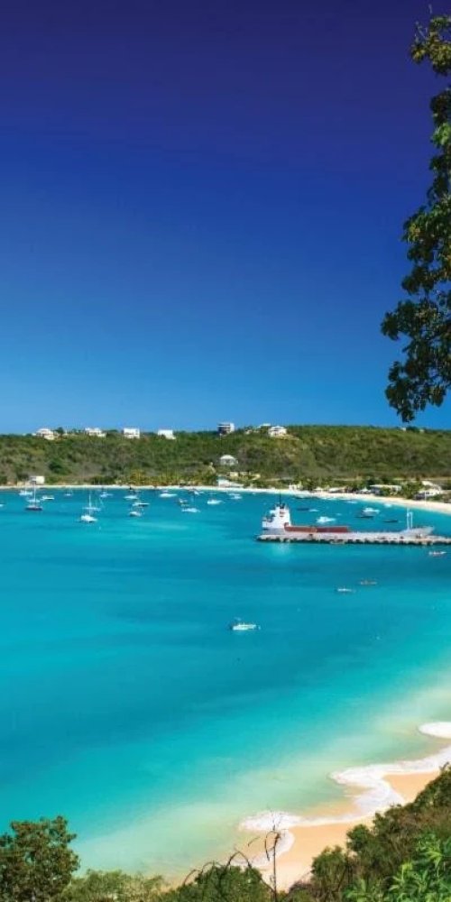 Tram on a quiet street of Anguilla in the late afternoon