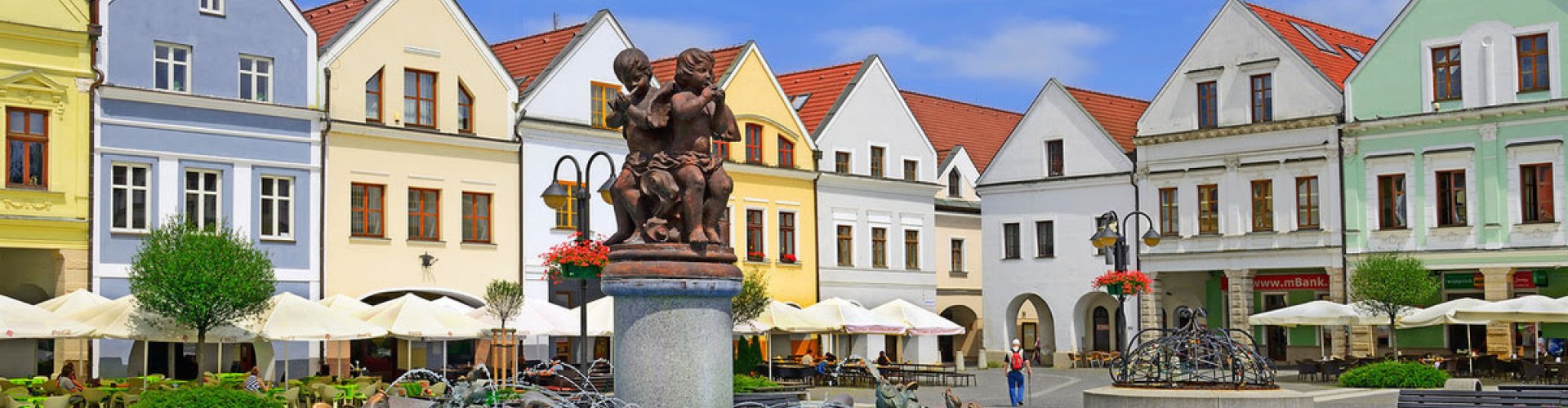 Night tram crossing cobblestones in Žilina