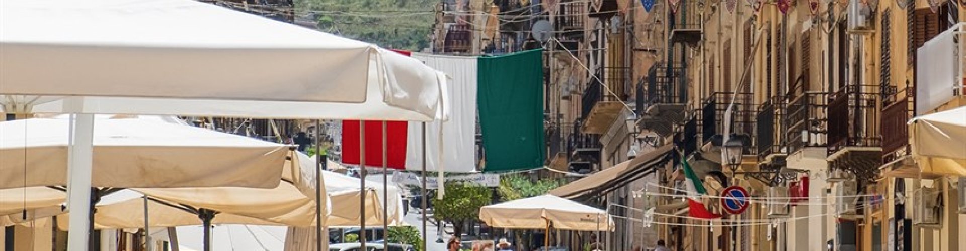 Night tram in Castellammare del Golfo on cobblestones