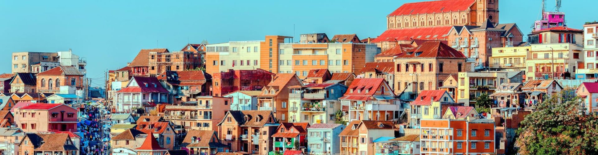 Night tram cruising cobblestone street in Antananarivo