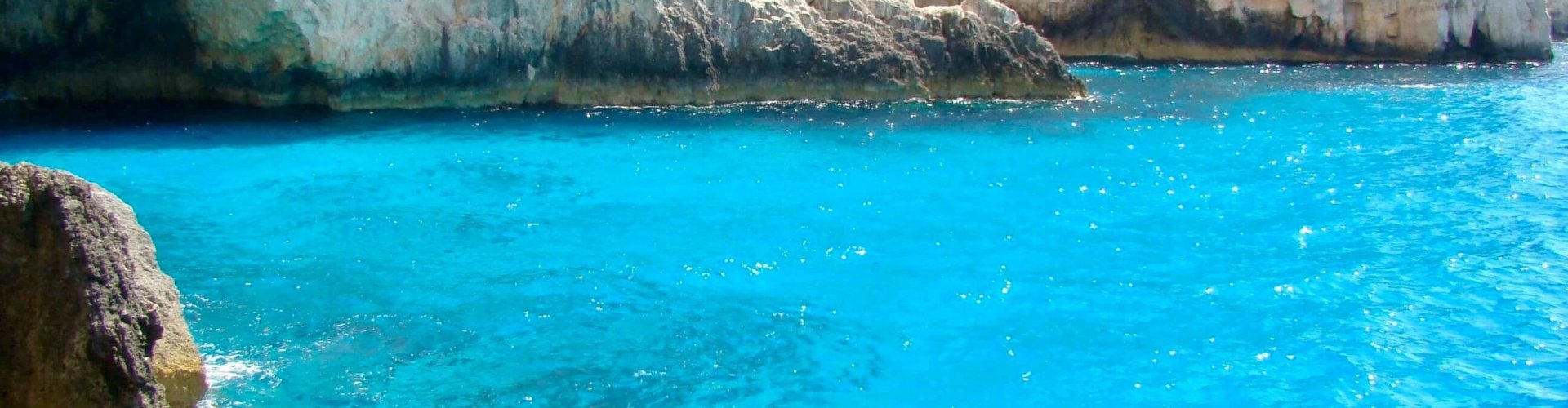 Night tram gliding on cobblestones in Limni Keri