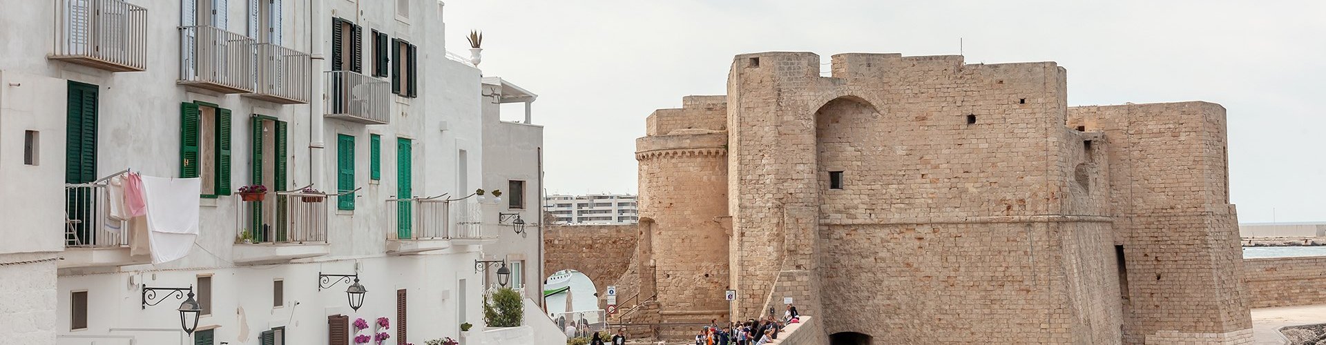 Night tram gliding on Monopoli’s cobblestones