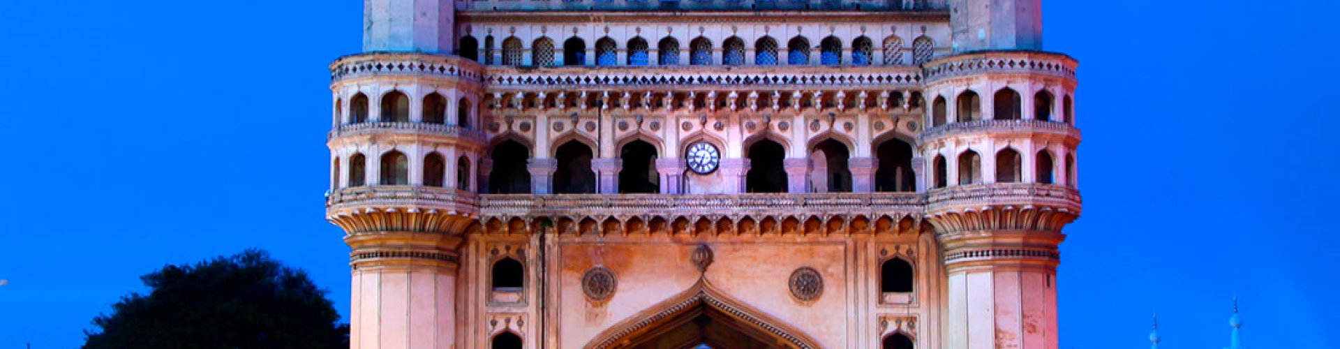 Night tram gliding on Hyderabad cobblestone street