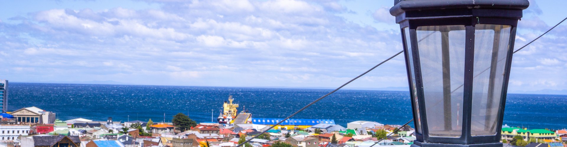 Night tram on cobblestoned street in Punta Arenas