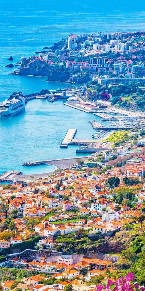 Passenger boarding a Funchal tram in late afternoon light