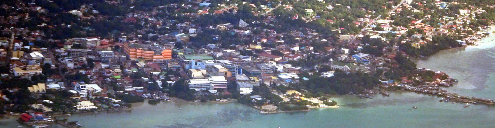Night tram on cobblestone street in Tagbilaran City, PH