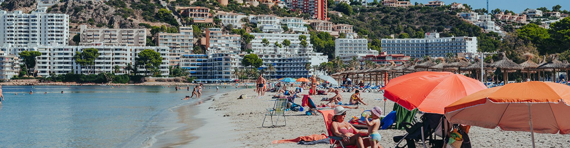 Night tram gliding over cobblestones in Santa Ponsa