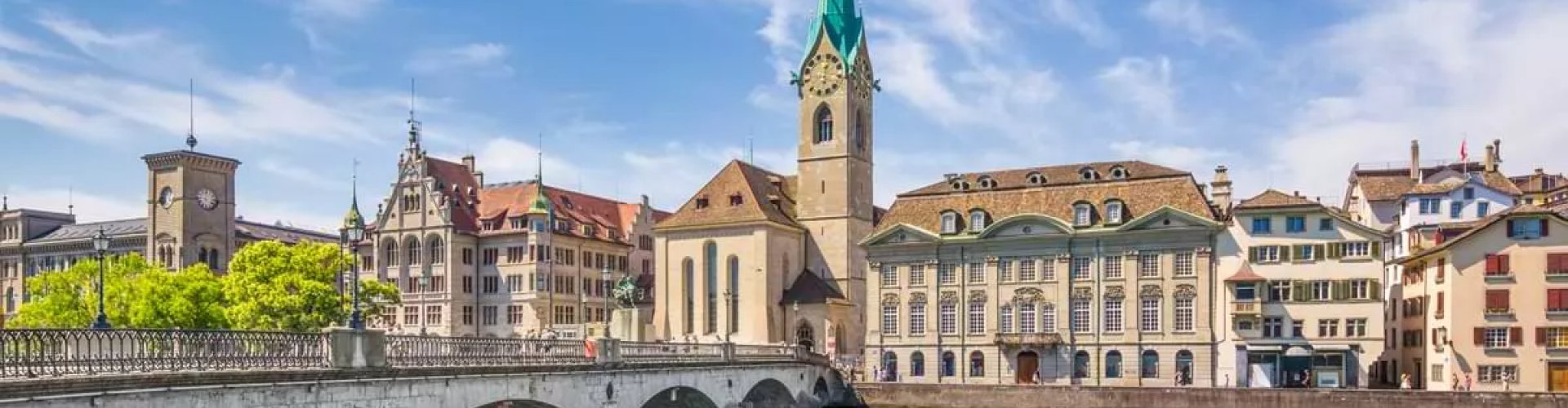 Night tram crossing cobblestone street in Zürich