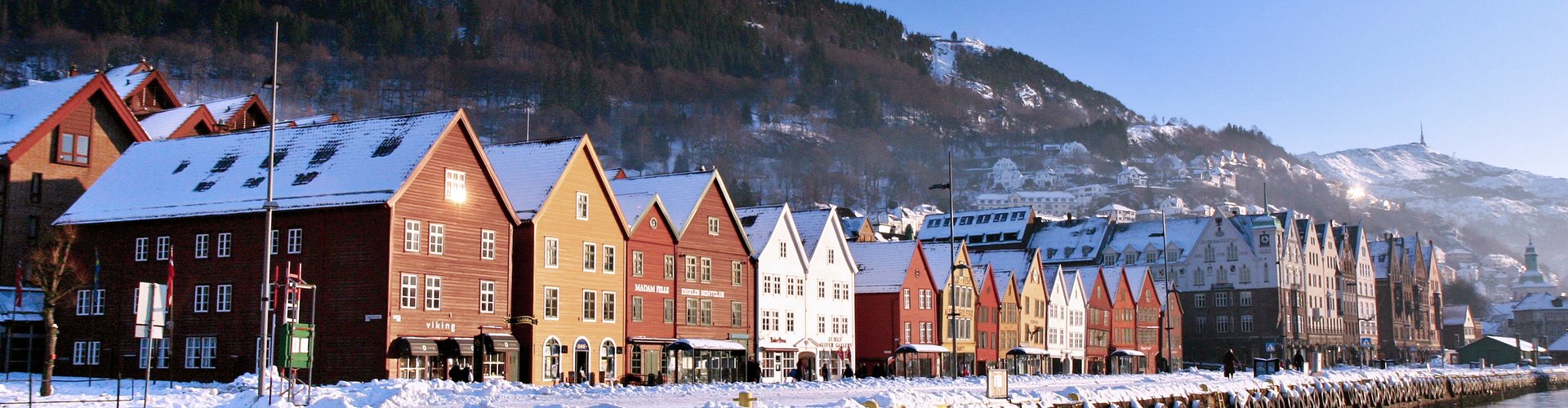 Night tram gliding on Bergen cobblestones