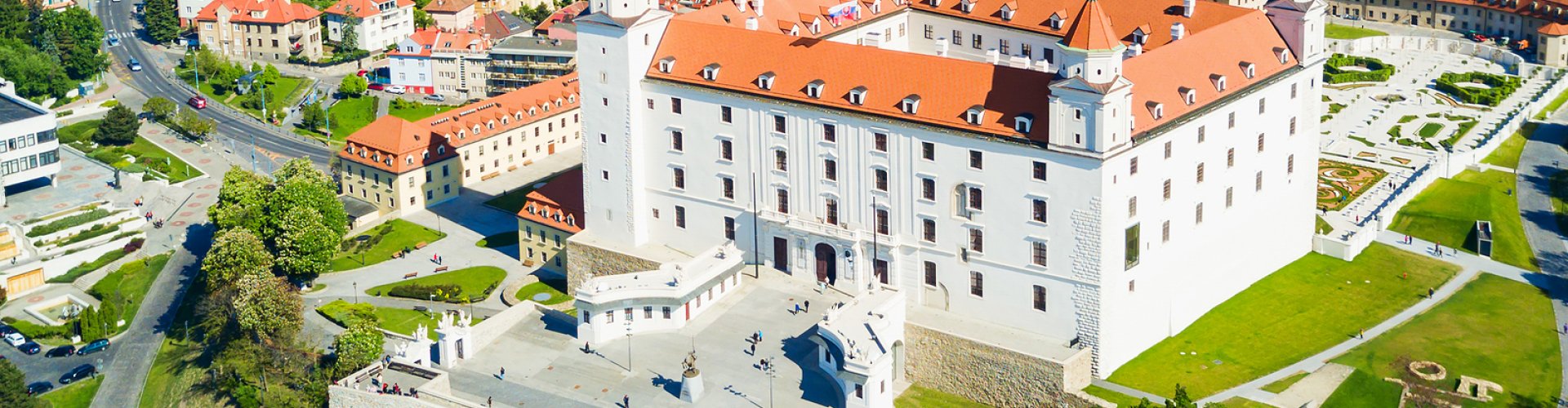 Night tram gliding over cobblestone streets in Bratislava