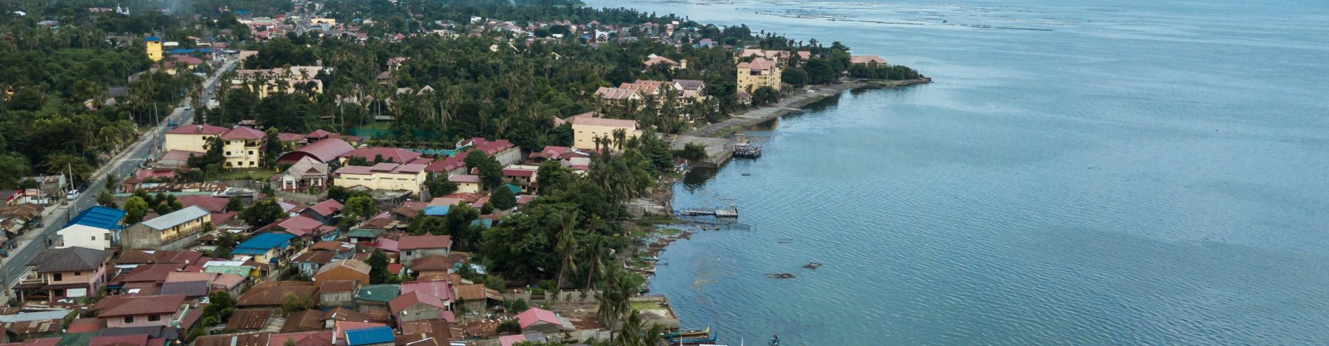 Night tram gliding over cobblestones in Batangas City