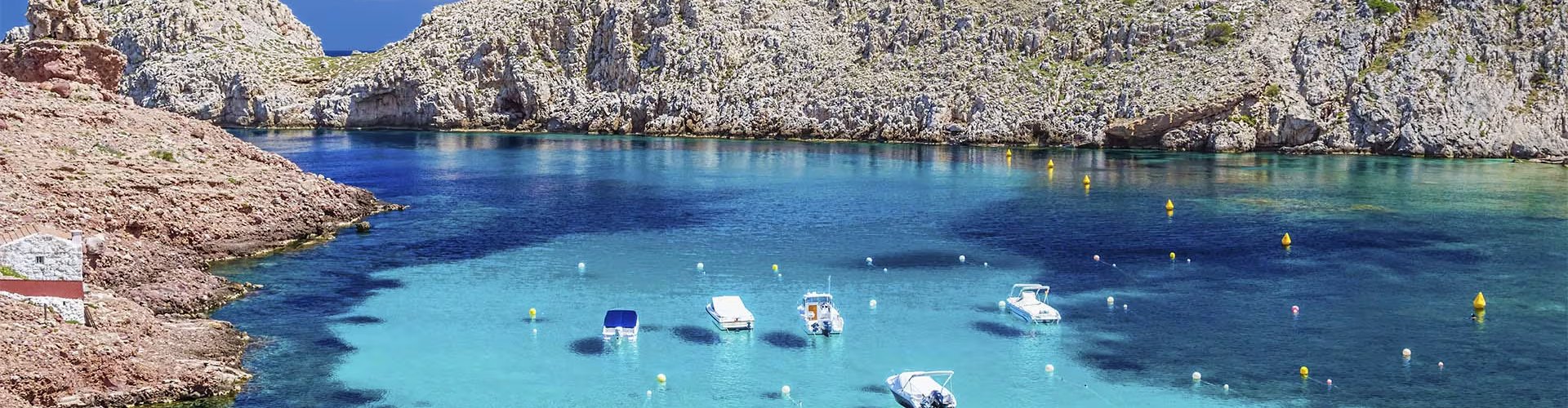Night tram gliding on Menorca cobblestones