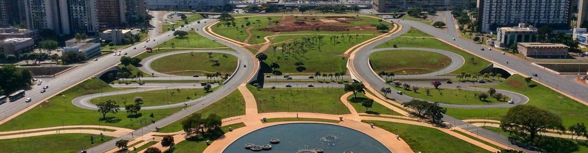 Night tram gliding over cobblestone street in Brasilia