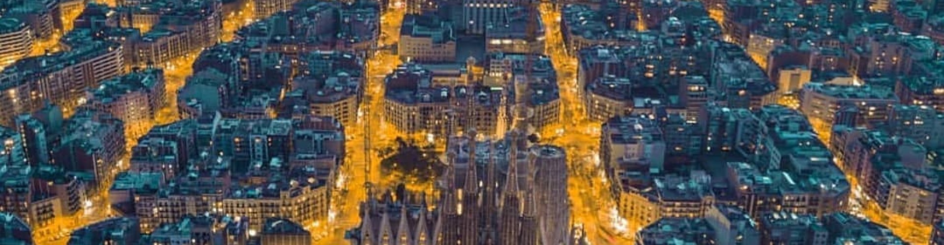 Night tram gliding over cobbled streets in Barcelona