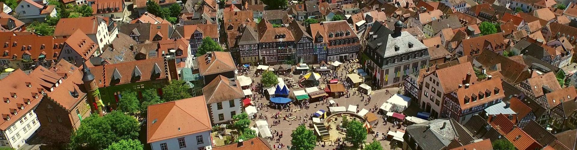 Night tram gliding on cobblestone streets in Gelnhausen