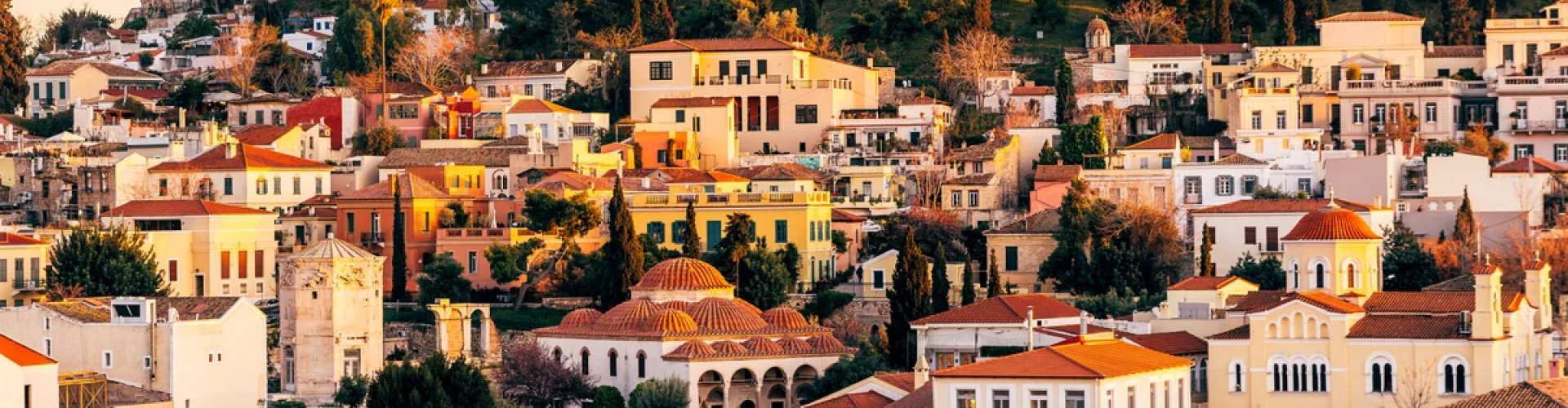 Night tram gliding over cobblestones in Athens