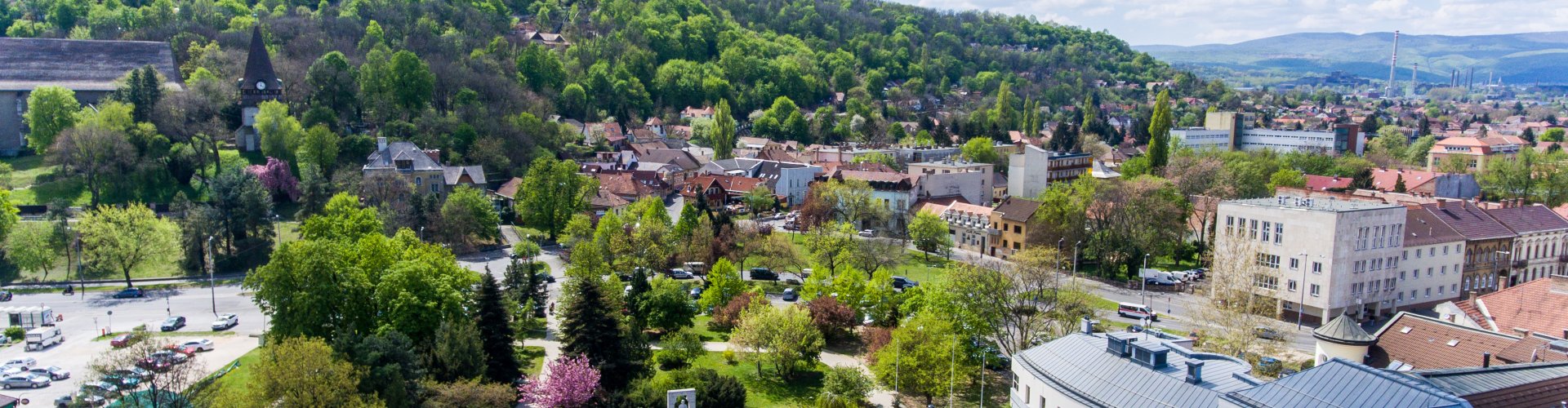 Night tram on cobblestone street in Miskolc