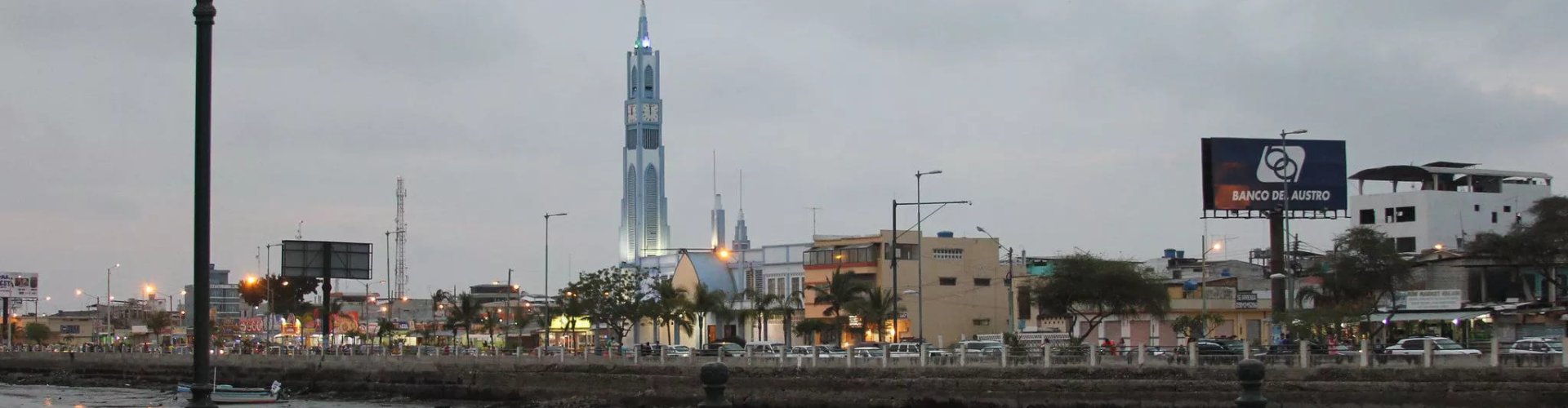 Busy Machala transit hub with trams and buses