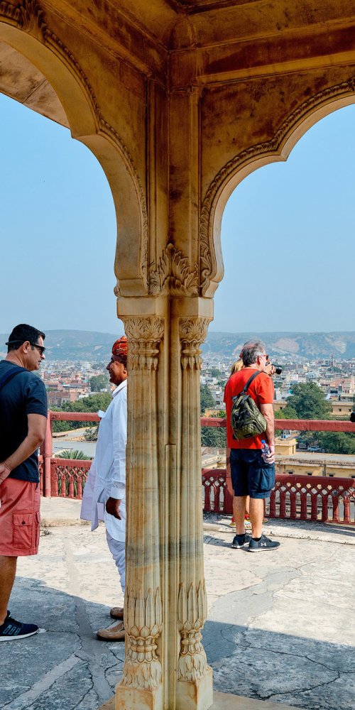 Commuters waiting at Jaipur tram stop during peak hour