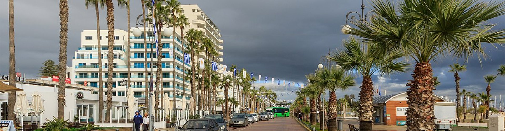 Night tram gliding over cobblestones in Larnaca