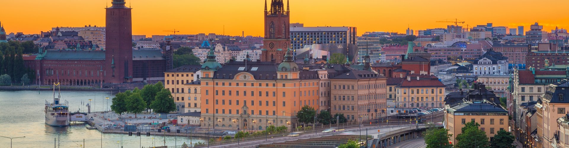 Night tram on cobblestone street in Stockholm