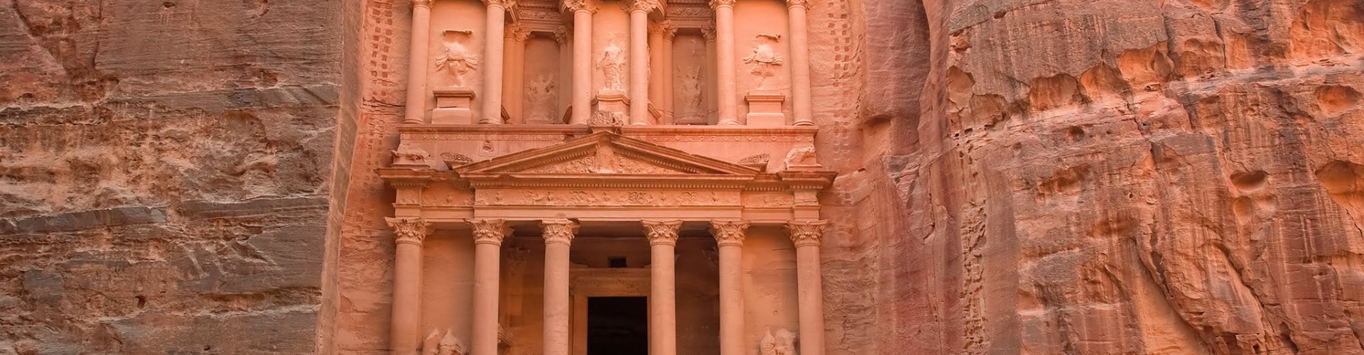 Night tram moving over cobblestone street in Amman