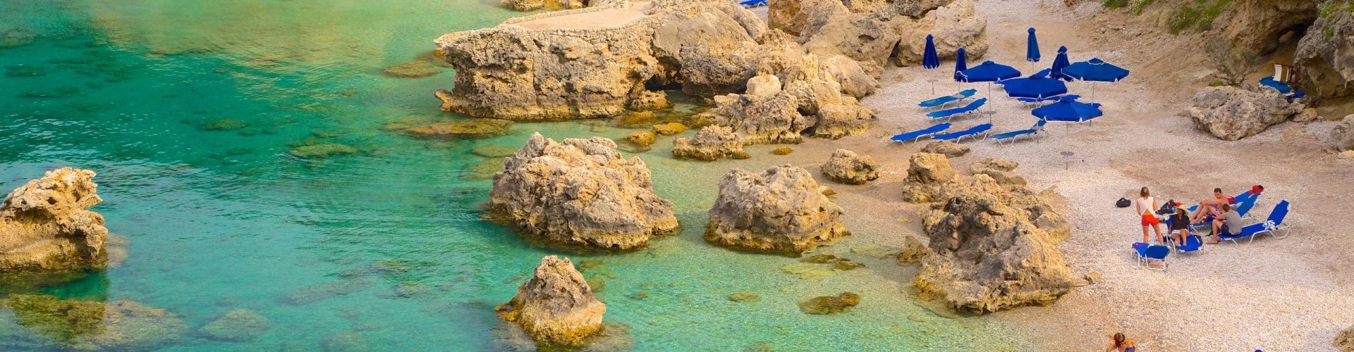 Night tram gliding through Faliraki cobblestone street
