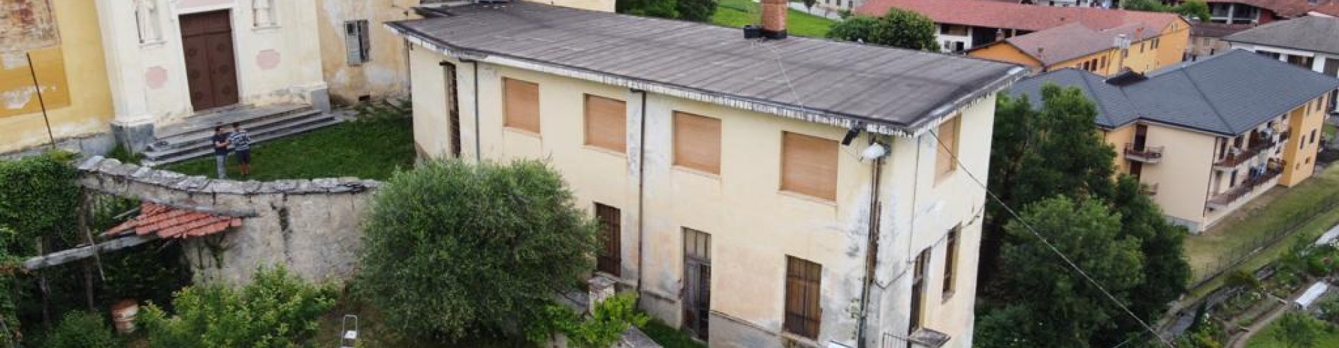 Night tram gliding over cobblestone street in Bernezzo