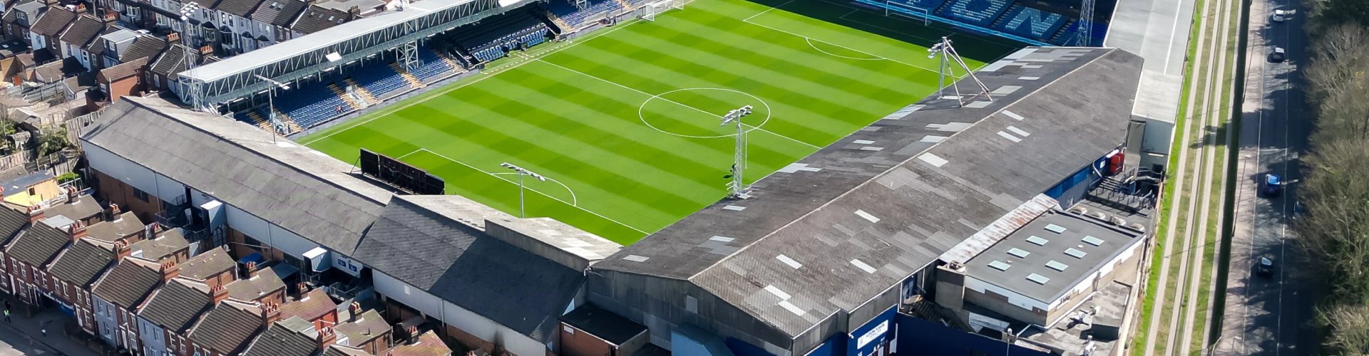 Night tram on cobblestone street, Luton