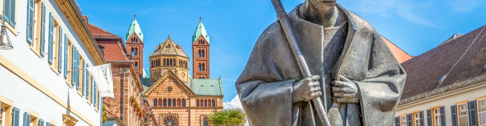 Night tram gliding over cobblestone street in Speyer