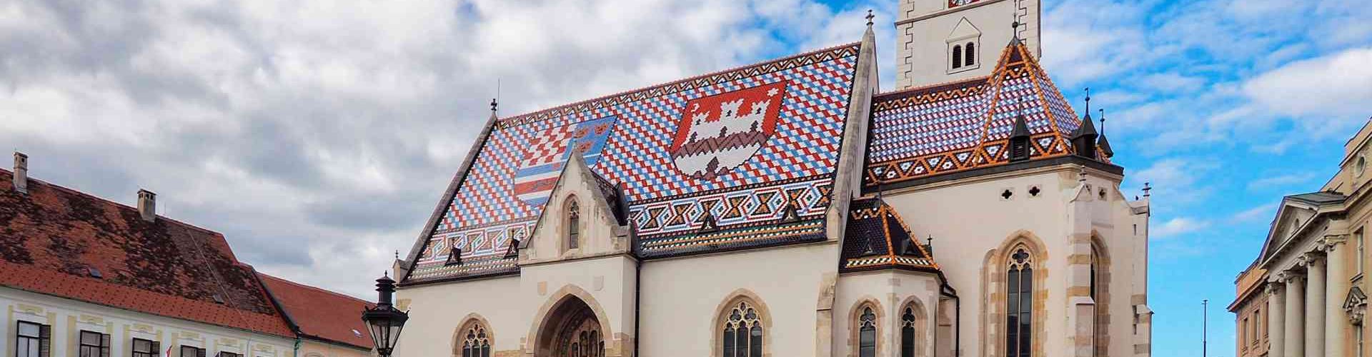 Night tram crossing Zagreb cobblestone street