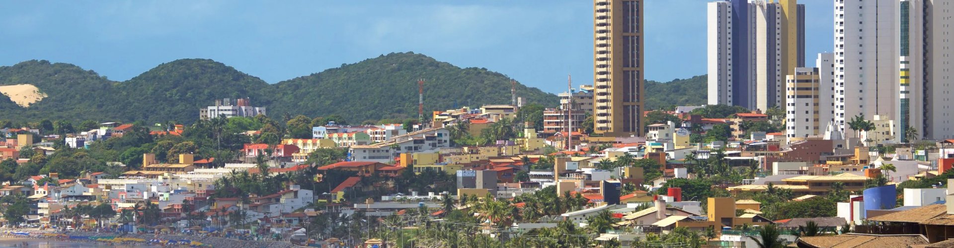 Night tram gliding over cobblestones in Ponta Negra