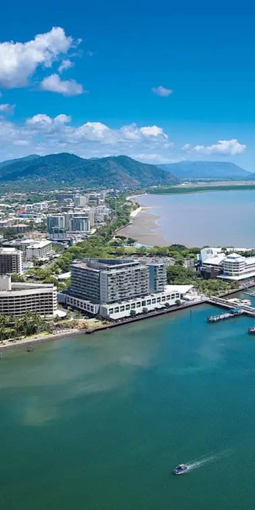 Tram moving through Cairns at sunset, a peaceful scene