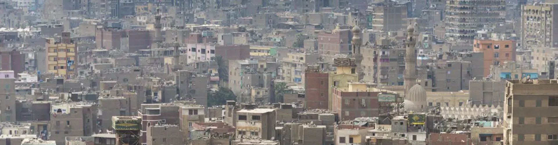 Night tram gliding over cobblestones in Cairo