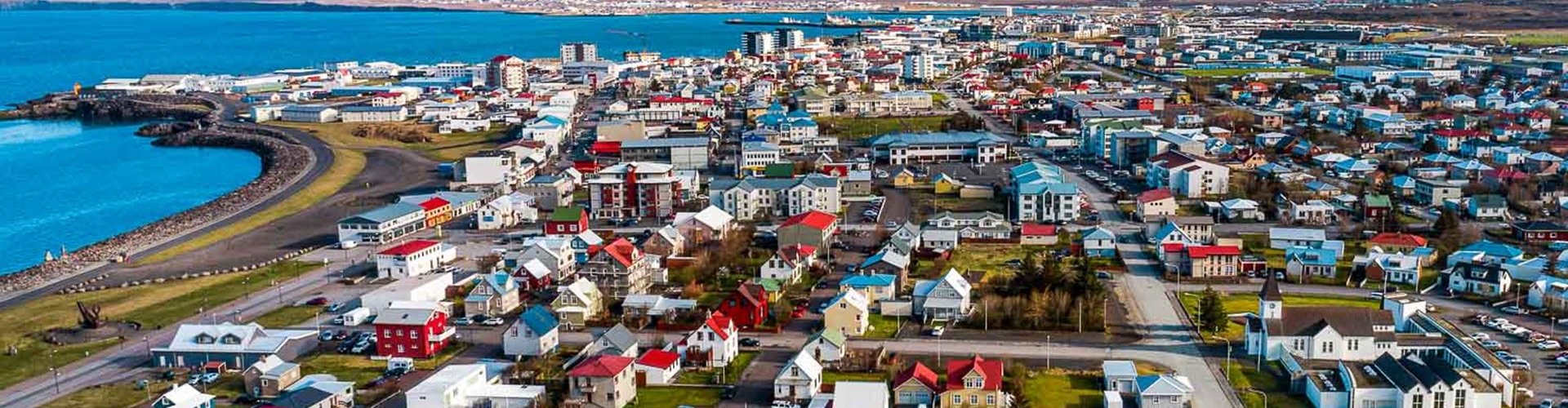 Night tram on cobblestone street in Keflavik
