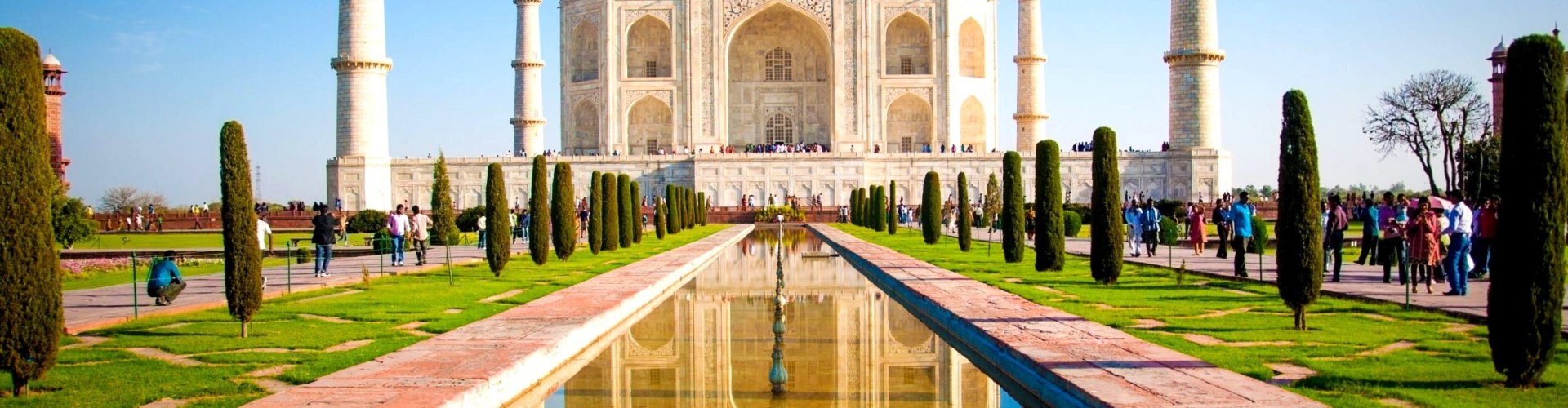 Night tram gliding on Agra cobblestone street illuminated by street lamps
