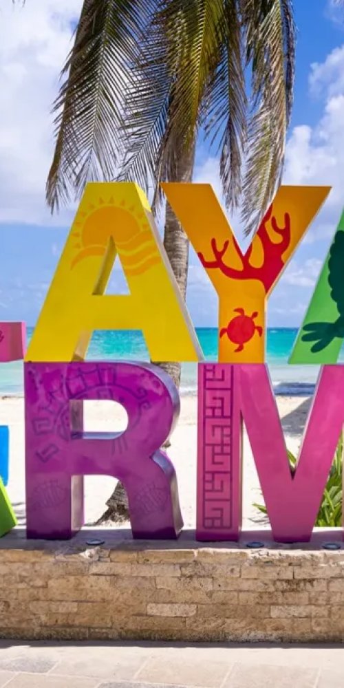 Woman biking in Playa del Carmen street