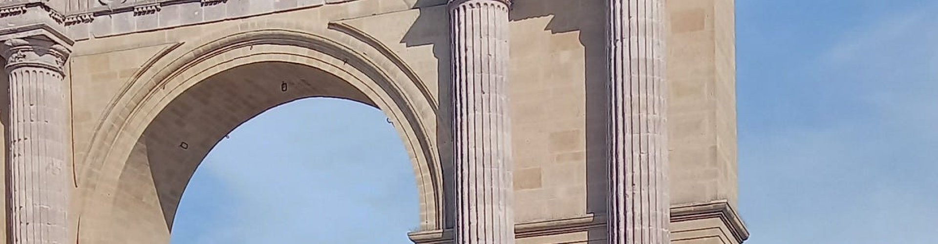 Night tram gliding over cobblestones in León